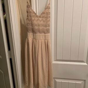 Neutral color dress with embroidery detail